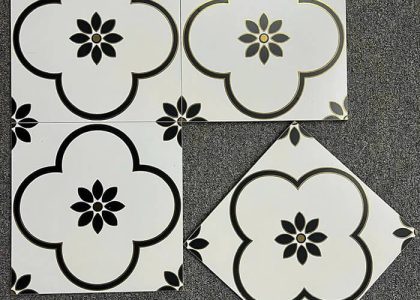 Chất liệu gạch bông khắc vàng kim là đá granite siêu bền, bề mặt ánh nhũ vàng, khó phai màu