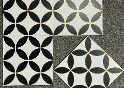 Chất liệu gạch bông khắc vàng kim là đá granite siêu bền, bề mặt ánh nhũ vàng, khó phai màu