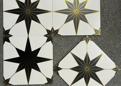Chất liệu gạch bông khắc vàng kim là đá granite siêu bền, bề mặt ánh nhũ vàng, khó phai màu