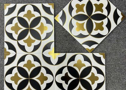 Chất liệu gạch bông khắc vàng kim là đá granite siêu bền, bề mặt ánh nhũ vàng, khó phai màu